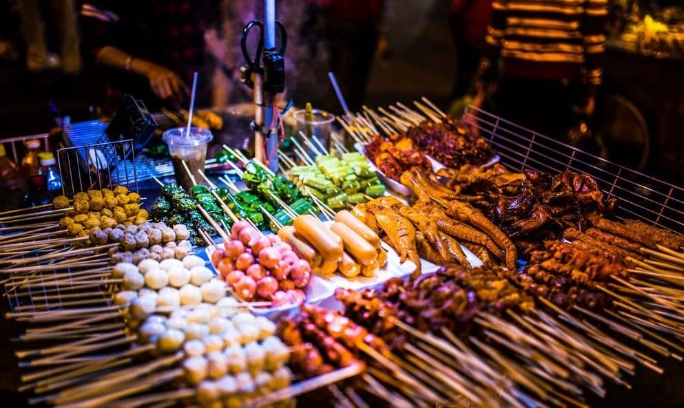 Endless rows of sizzling grills at Quy Nhon Food Street